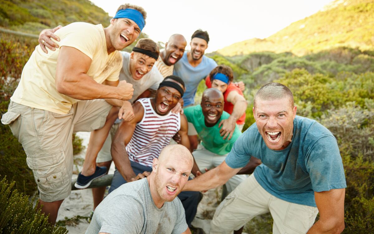 Men cheering outdoors in a natural setting — connection that holds up.